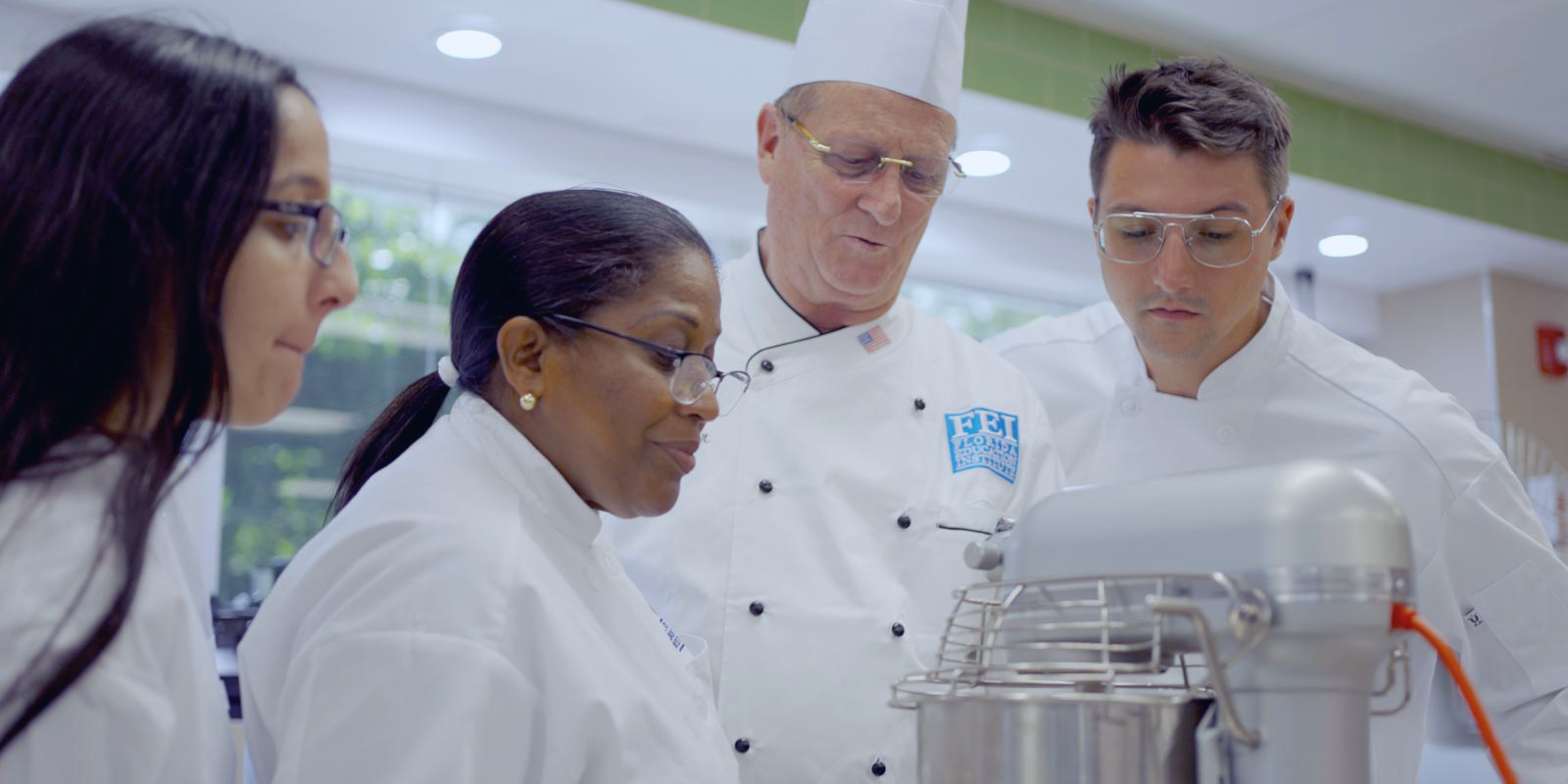 banner, students and instructor of Pastry Baking Arts